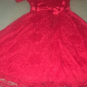 A  beautiful red dress,bought it but never worn it